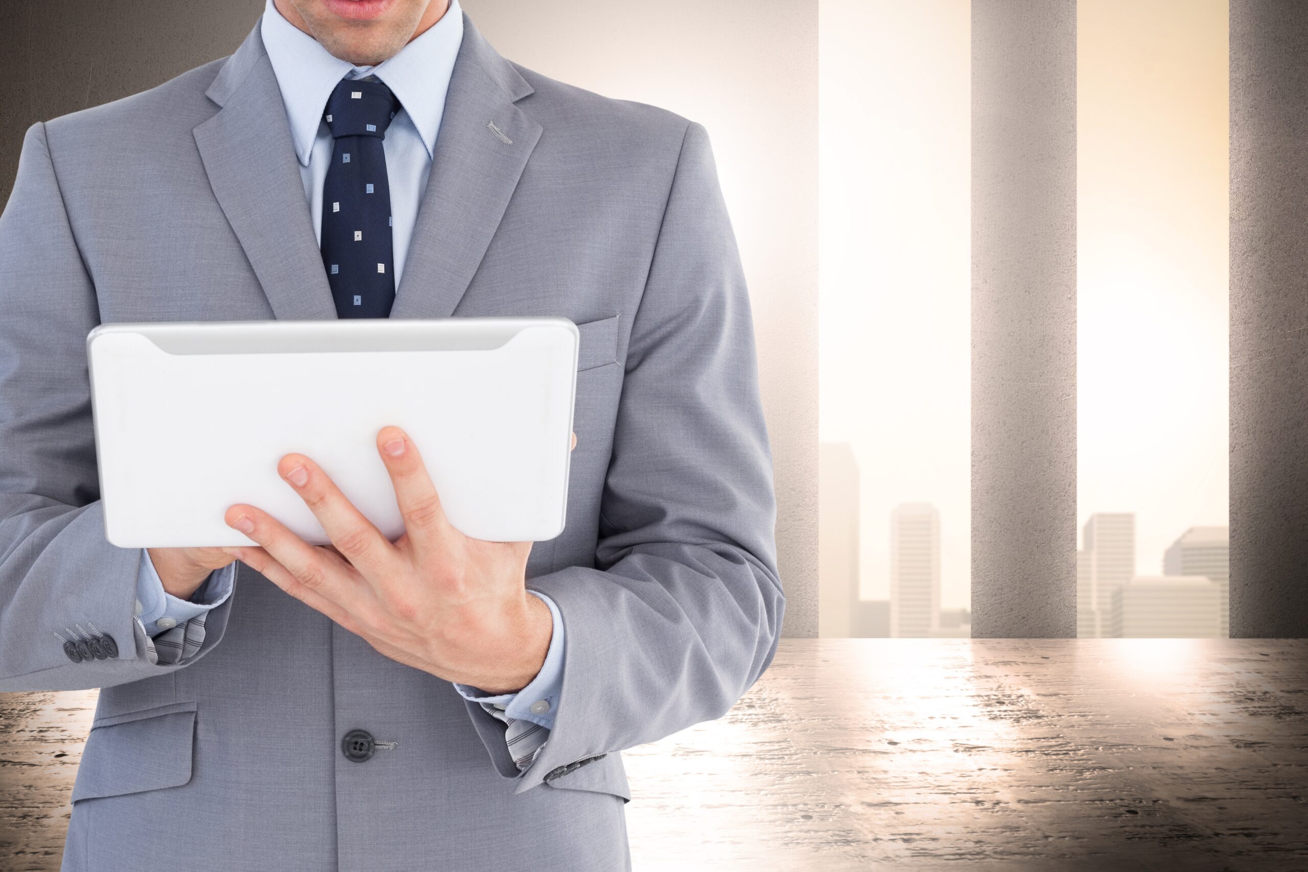 elegant businessman working with tablet